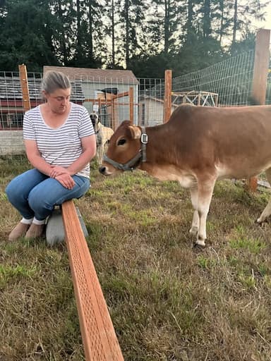 Christine with a Jersey cow at RiverHouse Dairy